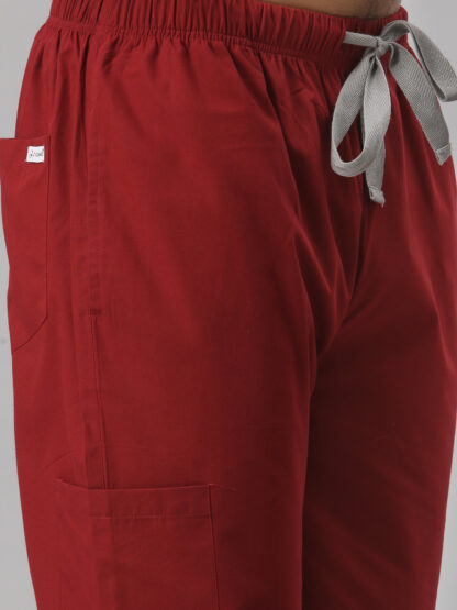 Designer Affordable basic Jogger Scrub for men in colour burgundy with pockets and stylish design