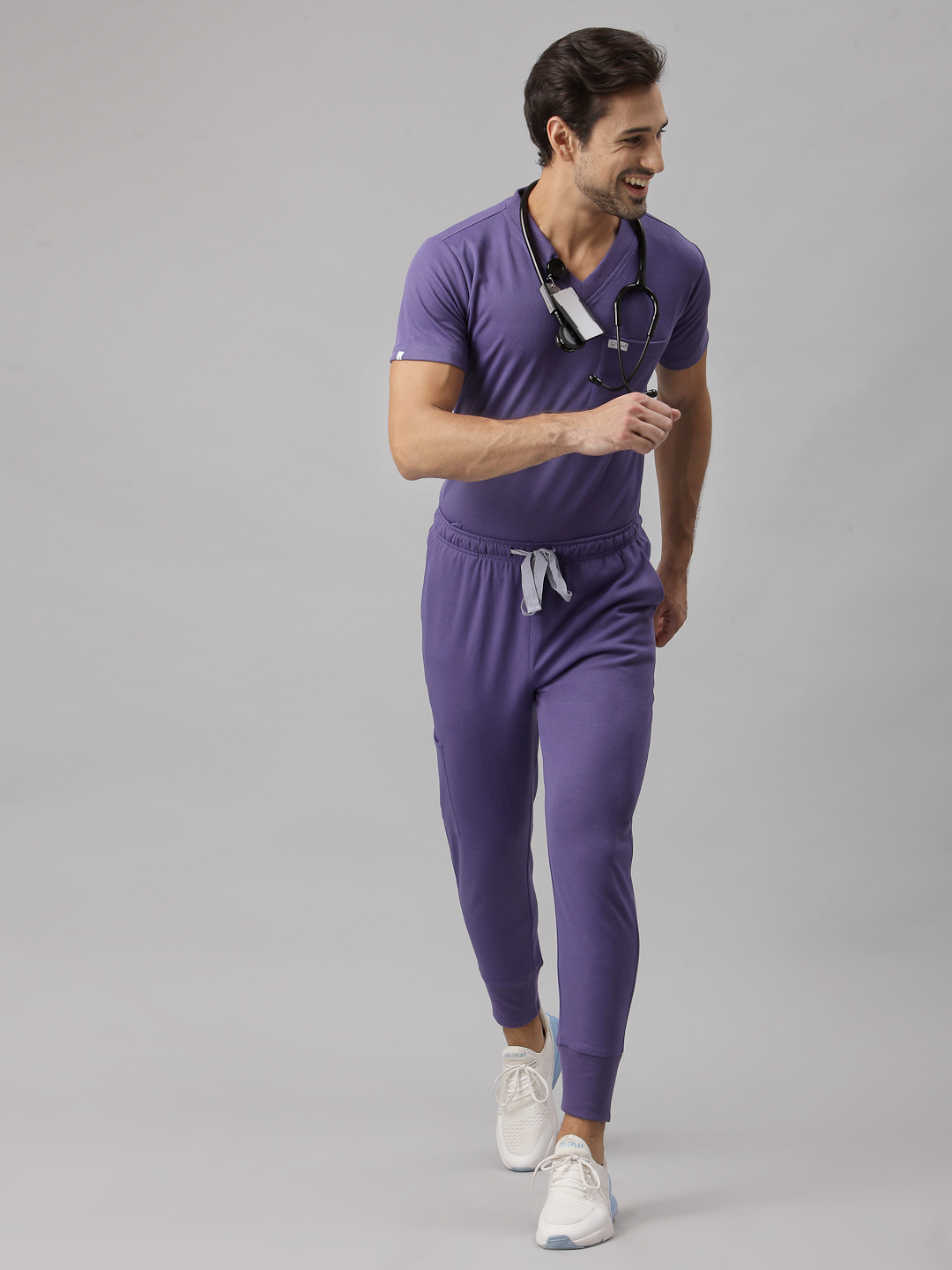High-waisted pants. Special male fit. Smart fit, modern V neck, straight leg pant. 3 pocket top & classic 5 pocket pant Elastic belt with drawstring Engineered with technical comfort.